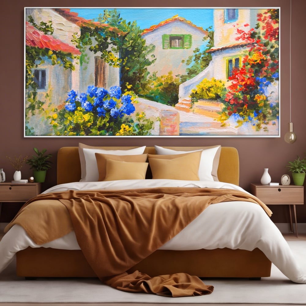 Tablou canvas cu pictura peisaj mediteranean cu case, in rama de aluminiu argintiu, pe perete intr-un dormitor